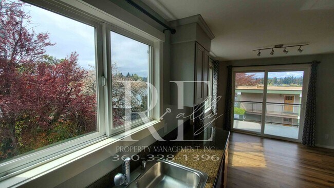 Building Photo - Modern Manette 1BR Condo with Private Pati...