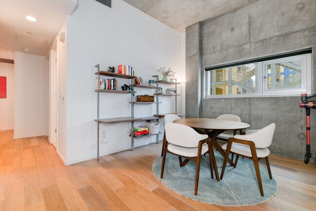 Dining area with bookshelf that doubles as a desk / dedicated workspace - 1025 Island Ave