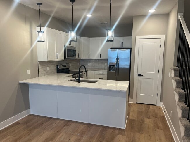 Building Photo - New Construction, 2 bed, 3 bath Row Home, with 2 car garage, fireplace, and rooftop deck!