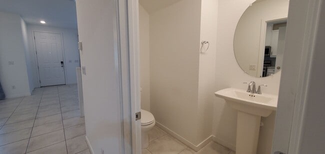 Building Photo - Beautiful townhome features a bright, open-concept layout