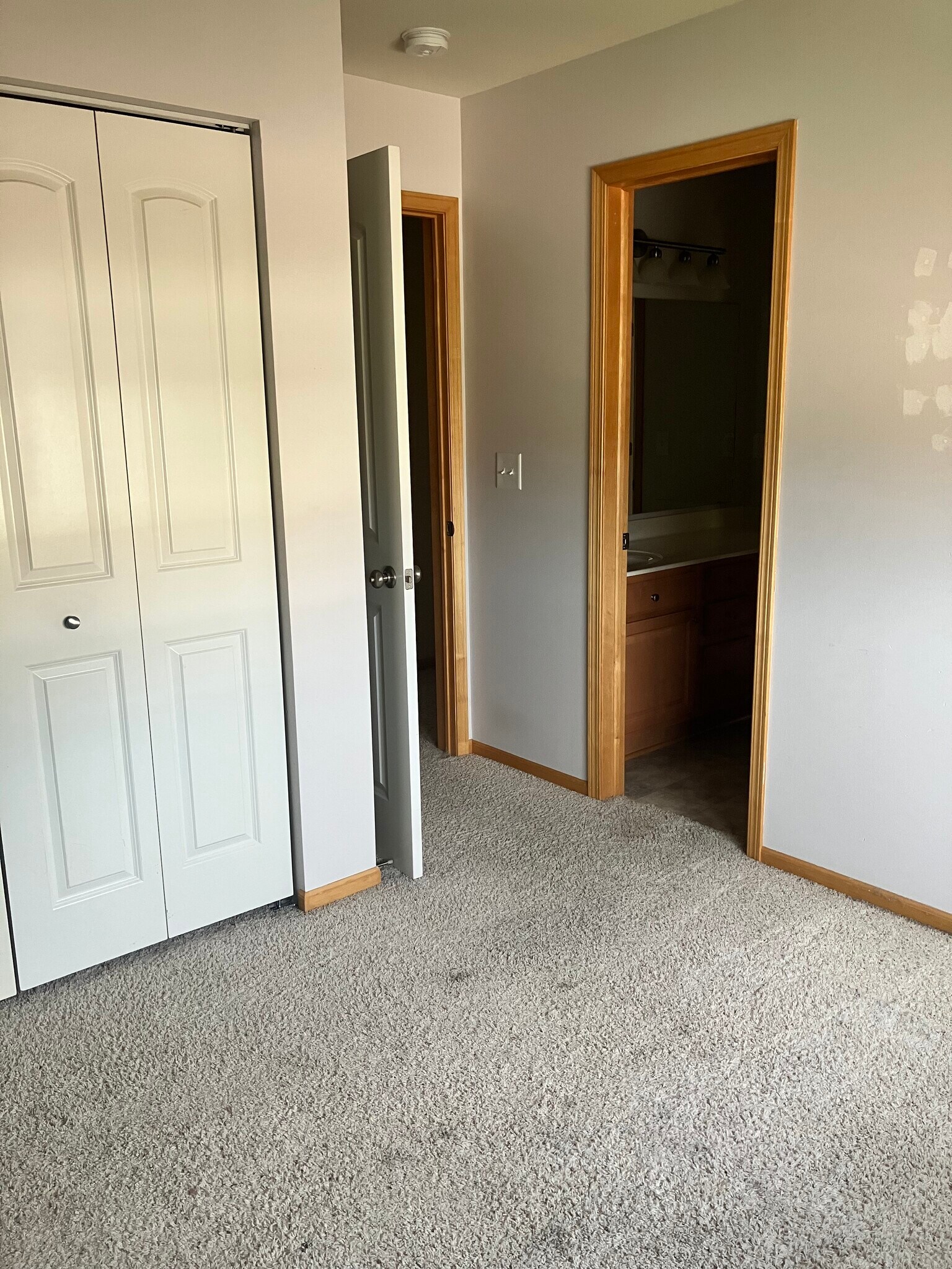 third bedroom closet and bath access - 906 SE Crossings Ln
