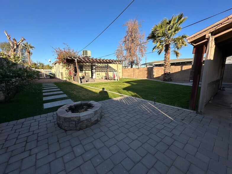 View from Patio 2 with built-in fire pit back toward main house and Patio 1 - 2513 N 28th St