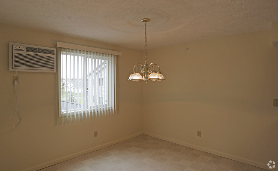 Dining Area with Air Conditioning Unit - New Country Village Apartments