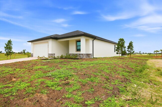 Building Photo - New Construction 3/2 Pool Home on Canal, $2,699, NW Cape Coral. The Only Thing Used Here Is the W...