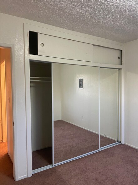 Bedroom; new carpet, full length mirror closet - 2458 S Normandie Ave