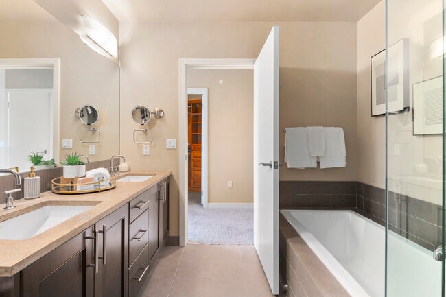 Luxury primary bathroom with tub and shower - 10610 NE 9th Pl