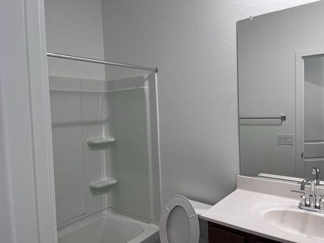 Building Photo - TOWN HOME WITH COMMUNITY POOL , GATED COMM...