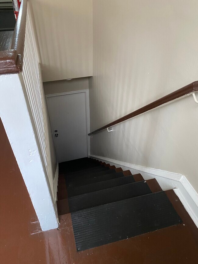 Stairway inside the apartment. - 114 E Main St