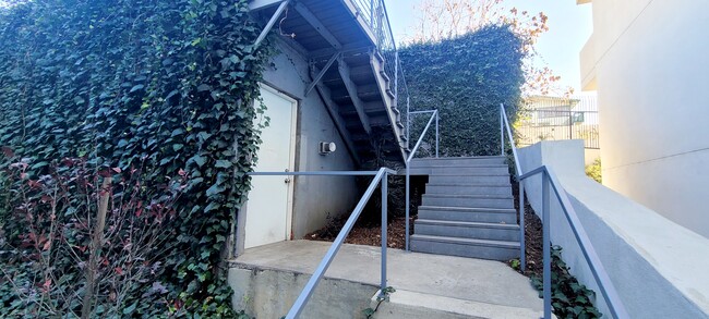 Landry Room door & stairs to parking lot located off alley - 348 Patton St