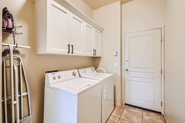 Laundry room with ironing board and supplies - 19475 N Grayhawk Dr