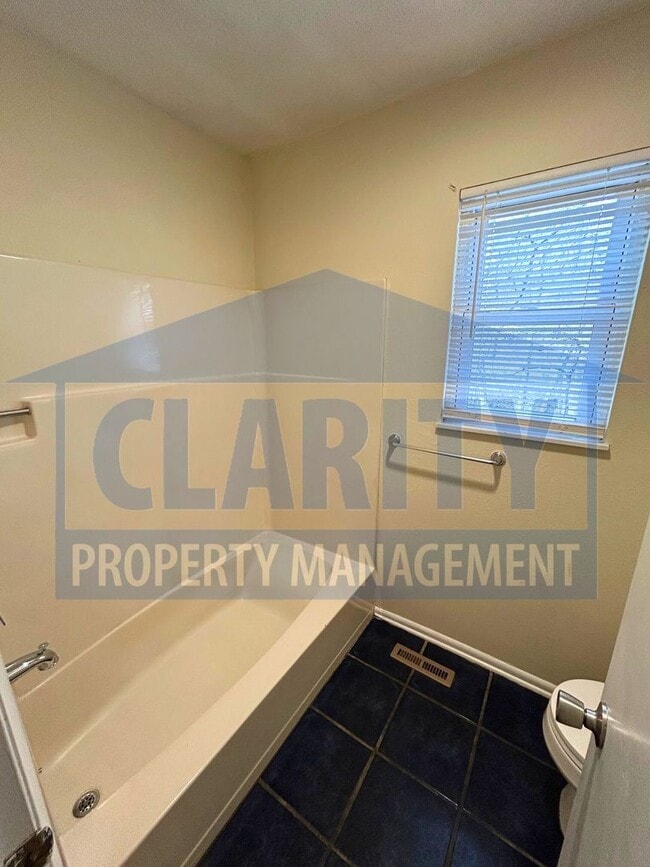 Building Photo - Three bedroom home w/ two bonus rooms!