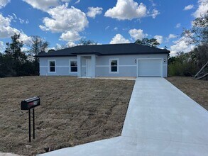 Building Photo - Brand-New 3BR/2BA Home with Garage – Serene Lake Placid Neighborhood