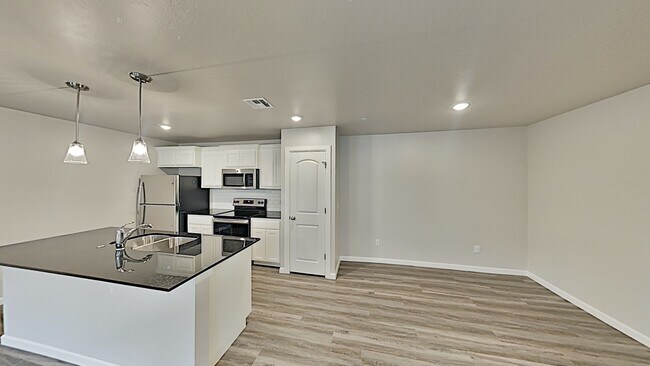 Building Photo - 2 Bedroom 2 Bathroom 2 Car Garage Duplex close to Broadway Extension, a short distance from Edmon...