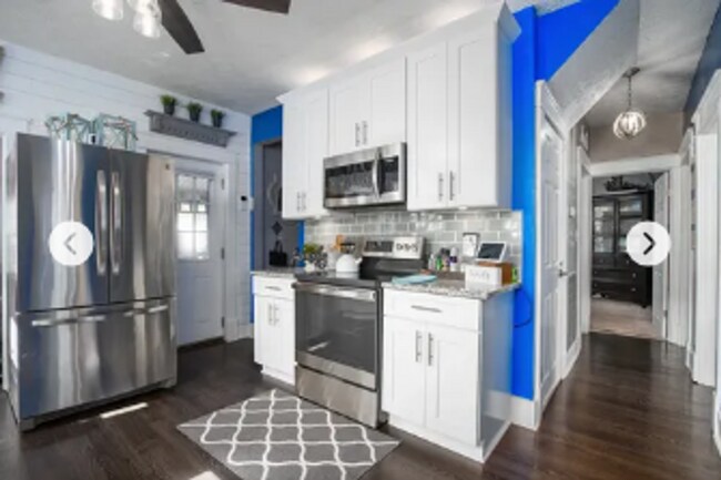 Building Photo - 4 Bedroom with a Hot Tub in the heart of t...