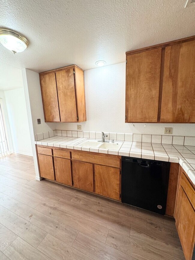 Building Photo - Bright Vaulted-Ceiling Condo in Gated Community • Pool • W/D Included • Move-In Ready