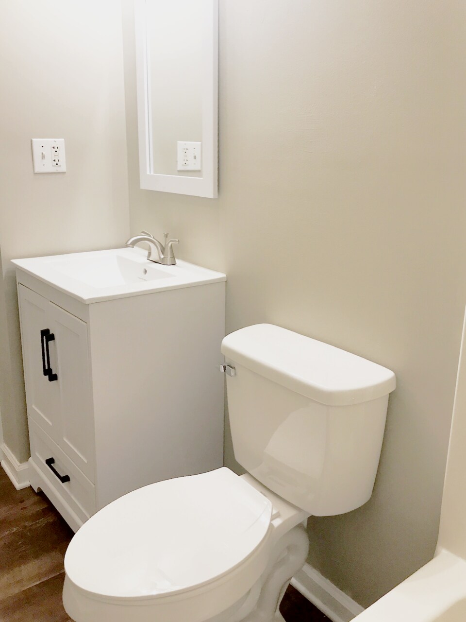 Bathroom with updated sink, lighting and toilet. - 216 Winters St