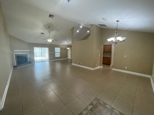 Building Photo - Spacious 4-Bedroom Pool Home – 2 Primary S...