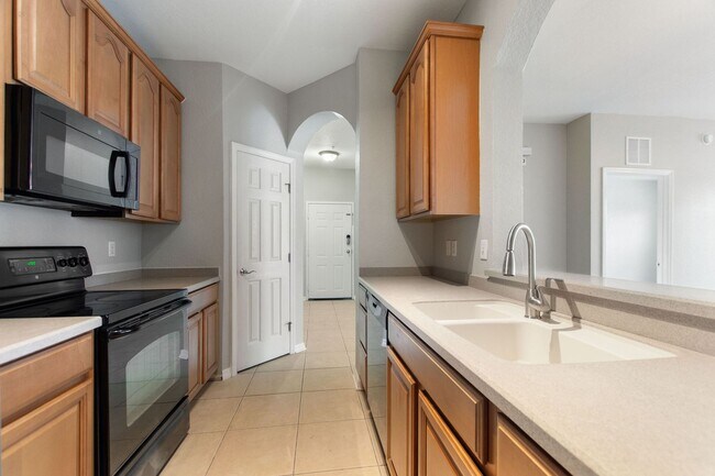 Building Photo - First floor condo in Champions Gate! Ready...