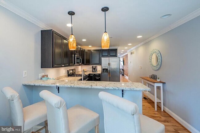 Kitchen with eat-in bar - 217 S Regester St