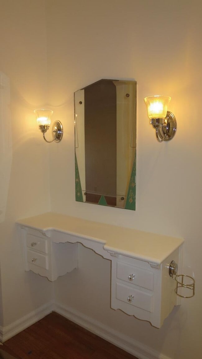 Master Bedroom's Attached Original Wood Vanity, Original Mirror, and Cedar-Paneled Closet - 1103 S Crescent Heights Blvd
