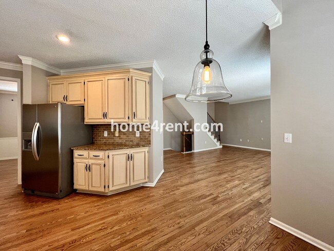 Building Photo - Updated Kitchen, Large Two Tiered Deck, Finished Basement in Blue Valley Schools!