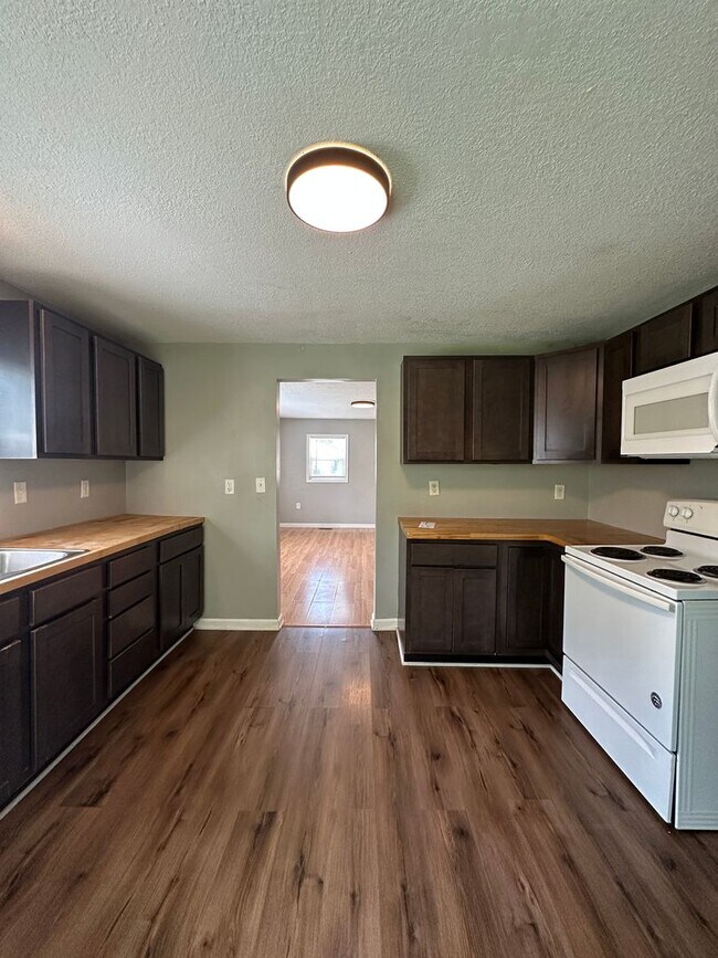Building Photo - Big Backyard Energy | 2BR City House with County Space!