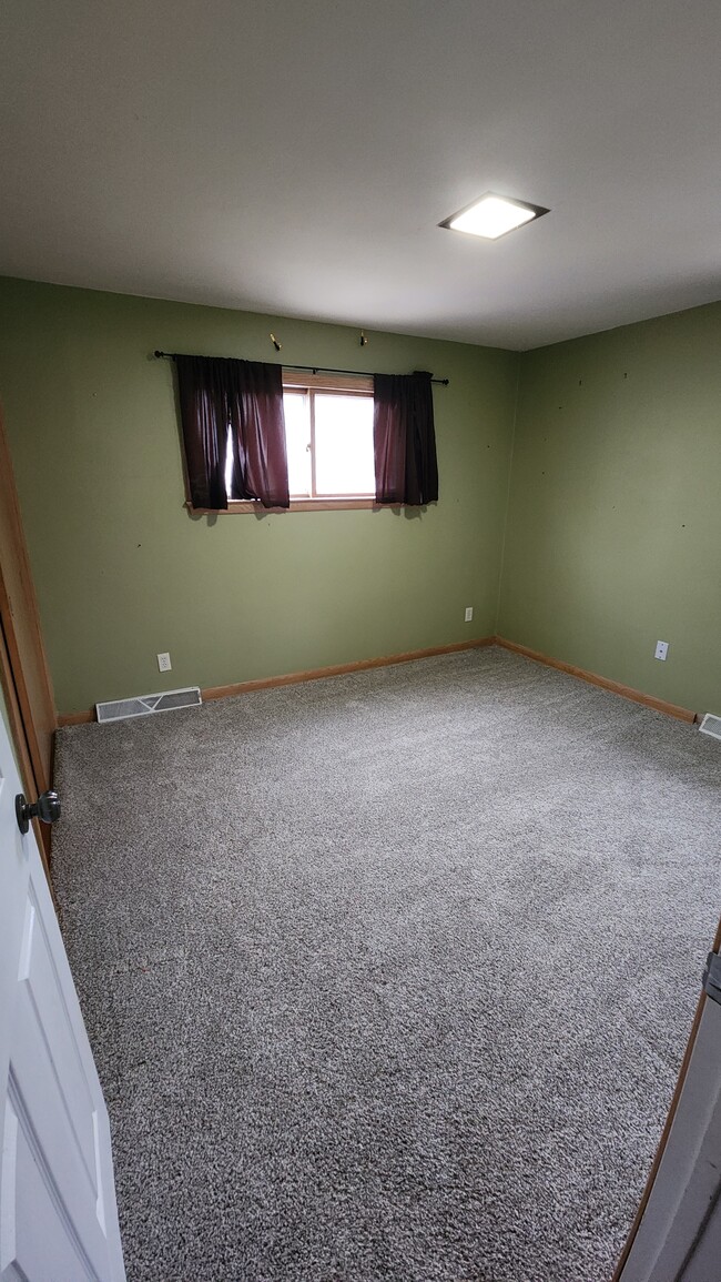 First floor bedroom #2 with closet. - 1718 S Walden Ave