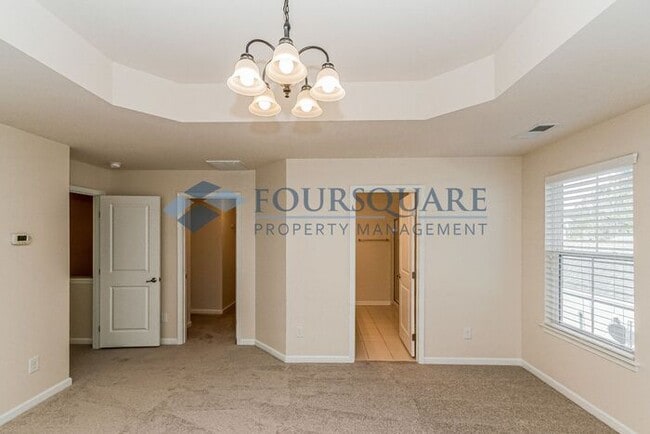 Building Photo - Spacious 3-Bed End Unit Townhome with 2-Car Garage & Private Patio | Prime Kitts Creek Location