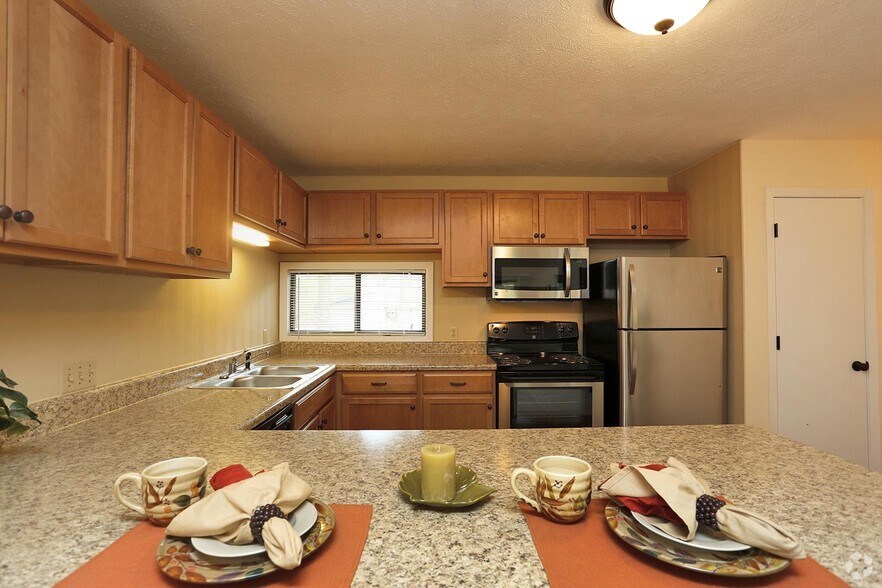 Renovated Kitchen with Breakfast Bar - Lake Clair Apartments