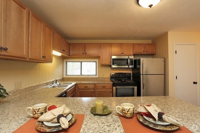 Renovated Kitchen with Breakfast Bar - Lake Clair Apartments