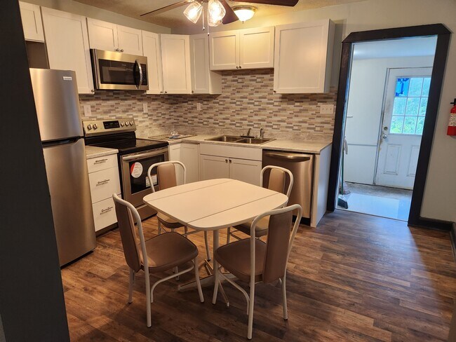 Kitchen Angle One (Common Area): Dishwasher, Microwave, Range, Refrigerator - 117 W Piedmont St