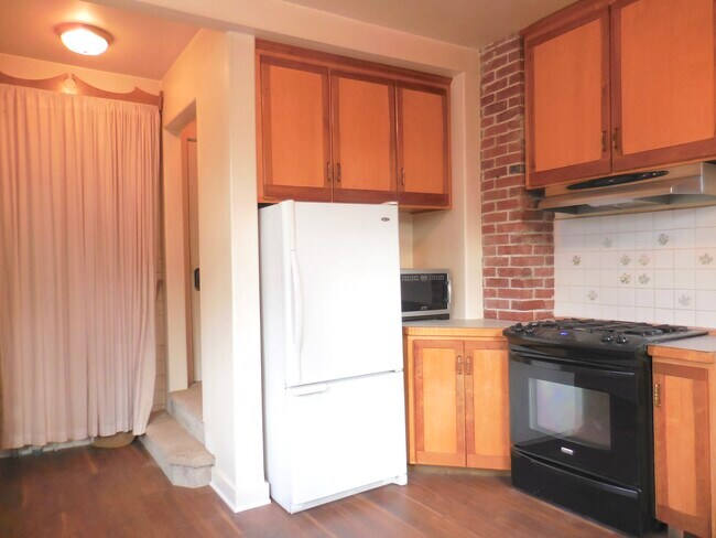 Kitchen w/ gas stove & to the left is the stairway - 4626 N Mullen St