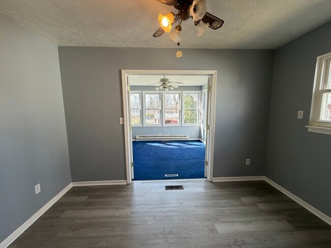 Building Photo - Bright Cape w/ Sunroom, Central Air, Big Basement & Backyard Shed