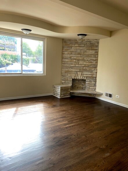 Living room with fireplace - 1415 W Devon Ave