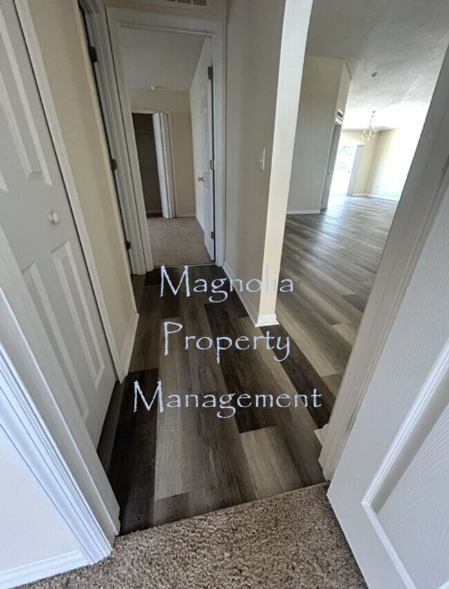 Building Photo - New Paint, Floors and Solid Surface Counte...