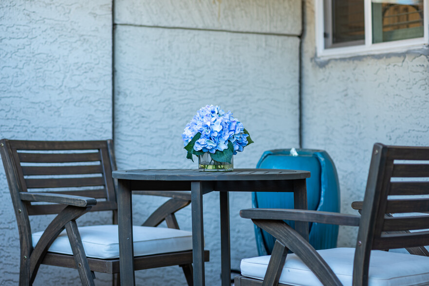 Zen garden with bistro table and waterfall for your morning coffee. - 4150 E Cactus Rd