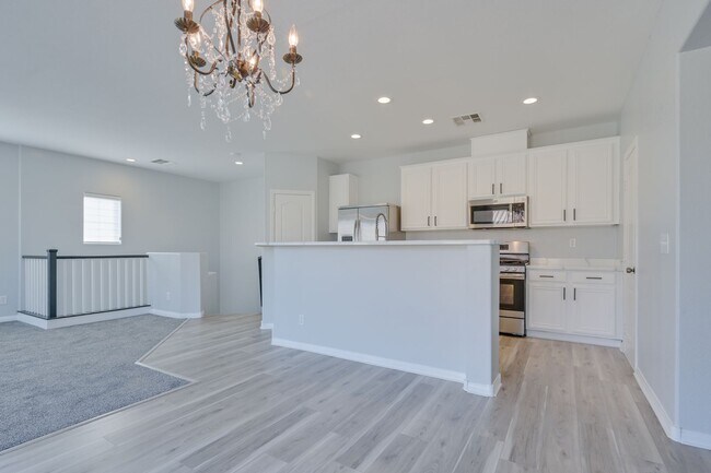 Building Photo - NW!! Gated!! Community Pool/Spa  Recreation Room!! New Paint!! New Flooring!!  Balcony!!  2 car g...