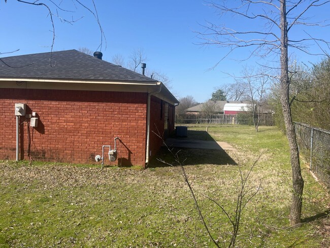 Primary Photo - This cozy house features a fenced backyard...