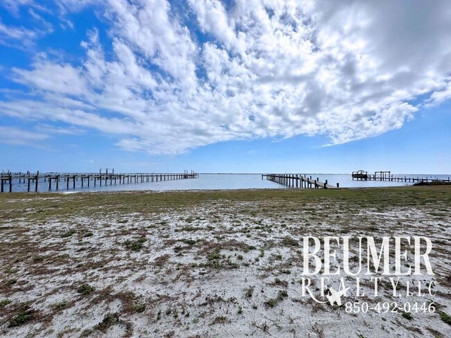 Building Photo - Move-In Ready Intercoastal Waterfront Townhome Steps to the water