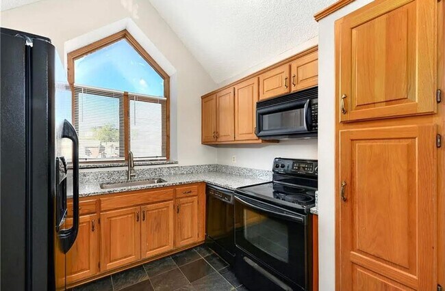 Building Photo - COMING SOON: Charming 2-Bedroom Condo in a...