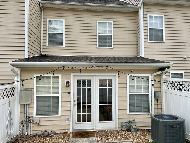 Back patio with privacy fence - 8608 Gauphin Pl