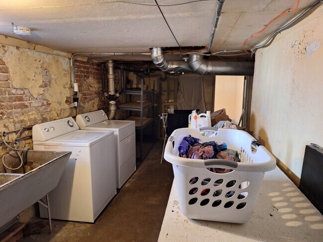 1/2 basement with washer/dryer and door to storage room (at back) - 293 South Lafayette Street
