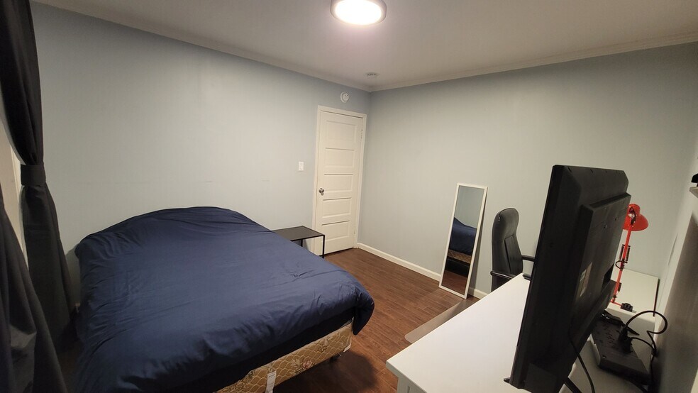 Second bedroom that comes with full size bed, Smart TV, and dresser - 1243 N Alexandria Ave