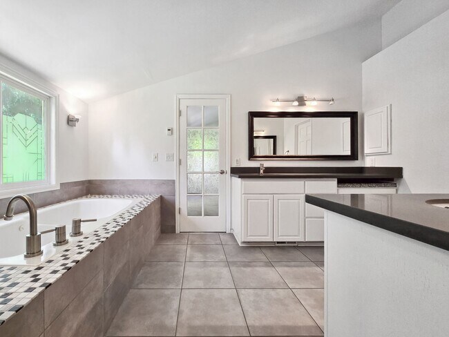 Building Photo - Stunning 4-Bedroom Home with Luxurious Mas...