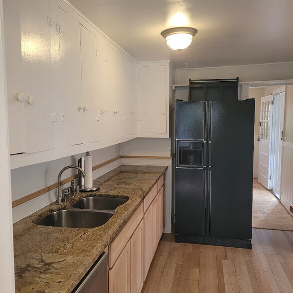 Kitchen looking toward front door - 114 Second St