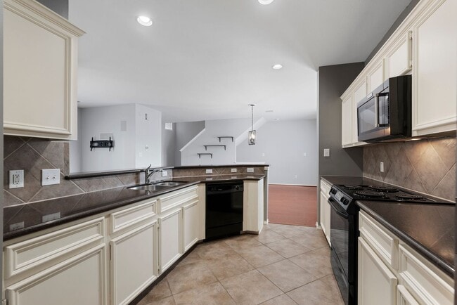 Building Photo - Come see this modern 3-story townhome in t...