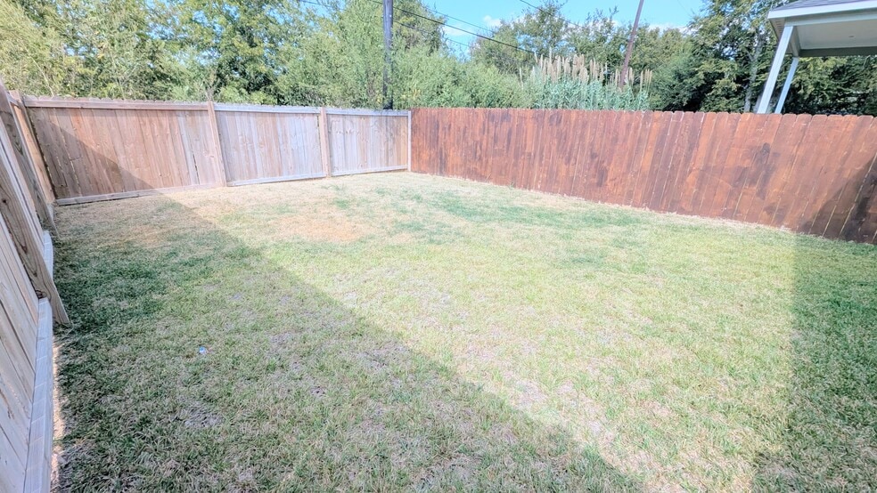Large fenced backyard is ready for your personal touch. - 13218 HP Johnson St