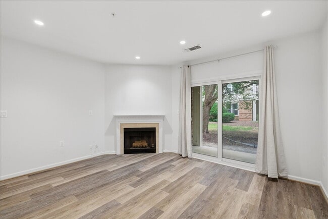 Building Photo - Commuter’s Paradise! Ground-Level 2BR Condo  Welcome home to this stunning, sun-filled 2-bedroom ...