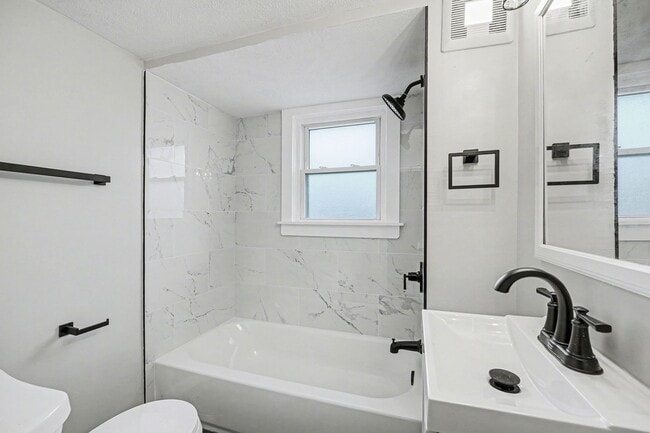 Building Photo - Updated First-Floor 2BR with Garage Parking and On-Site Laundry