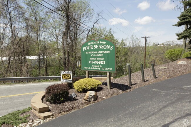 sign - Four Seasons Apartments